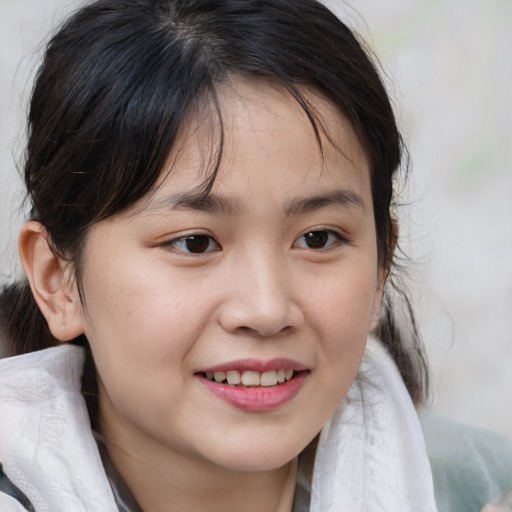 Joyful white child female with medium  brown hair and brown eyes