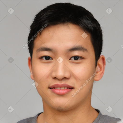 Joyful asian young-adult male with short  black hair and brown eyes