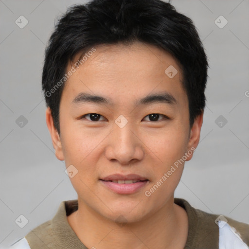 Joyful asian young-adult male with short  black hair and brown eyes