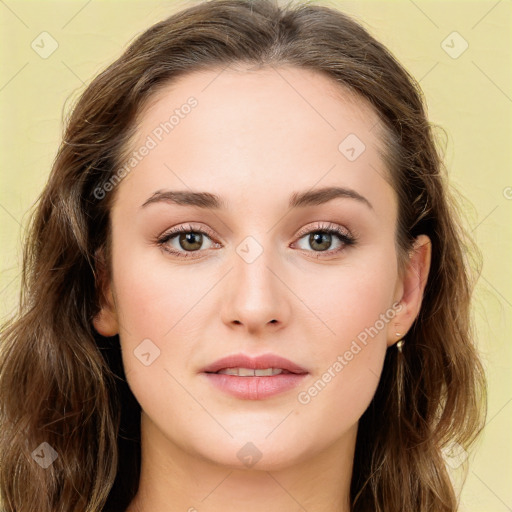 Joyful white young-adult female with long  brown hair and green eyes