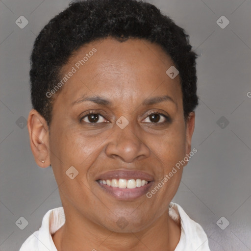 Joyful black adult female with short  brown hair and brown eyes