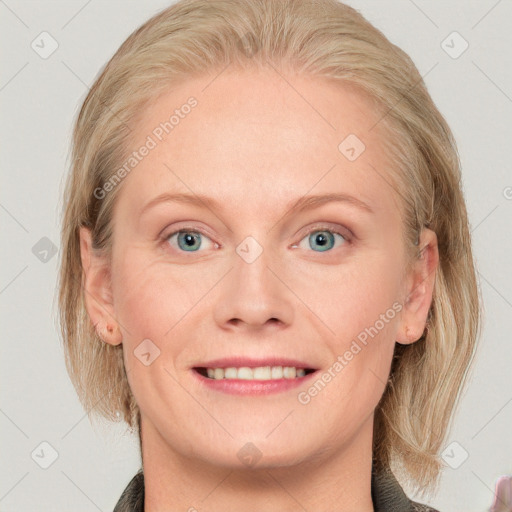 Joyful white adult female with medium  brown hair and blue eyes