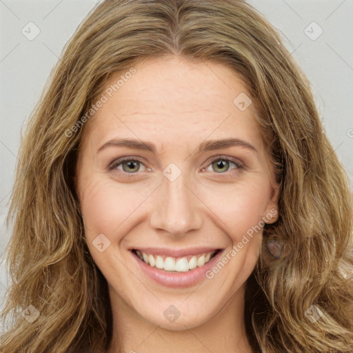 Joyful white young-adult female with long  brown hair and green eyes