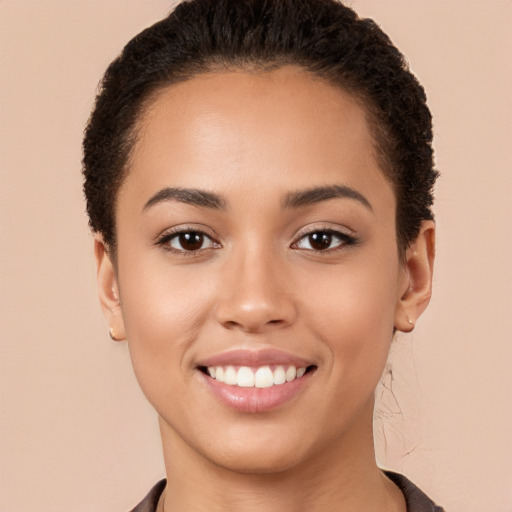 Joyful white young-adult female with long  brown hair and brown eyes