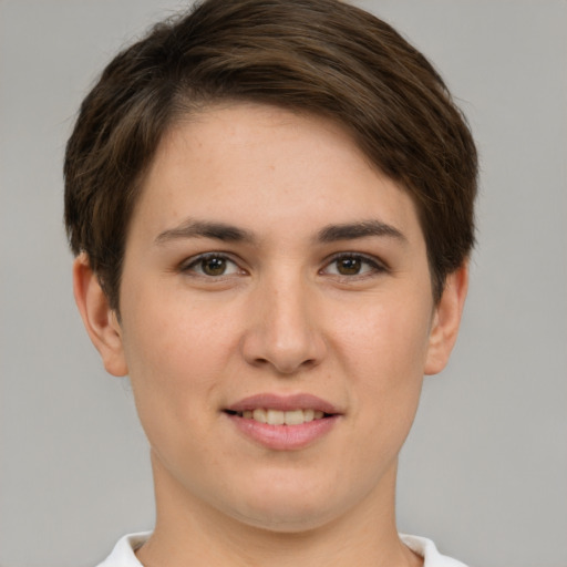 Joyful white young-adult female with short  brown hair and brown eyes