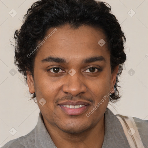 Joyful black young-adult male with short  brown hair and brown eyes