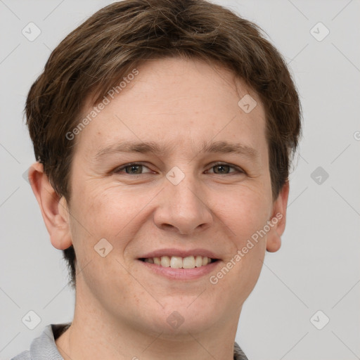 Joyful white adult female with short  brown hair and grey eyes