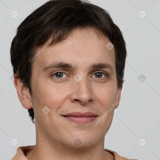 Joyful white adult male with short  brown hair and brown eyes