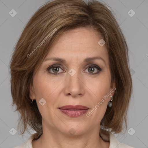 Joyful white adult female with medium  brown hair and brown eyes