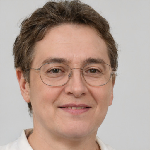 Joyful white adult male with short  brown hair and grey eyes