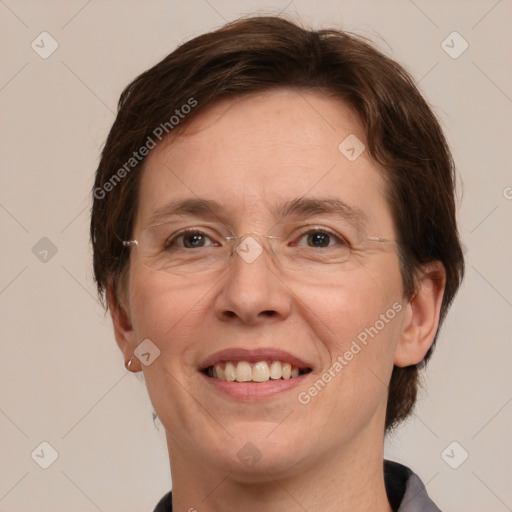 Joyful white adult female with short  brown hair and grey eyes