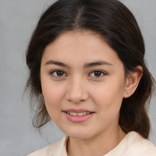 Joyful white young-adult female with medium  brown hair and brown eyes
