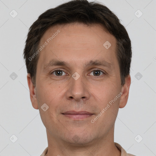 Joyful white adult male with short  brown hair and brown eyes