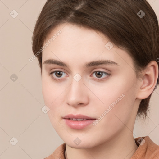 Neutral white young-adult female with short  brown hair and brown eyes