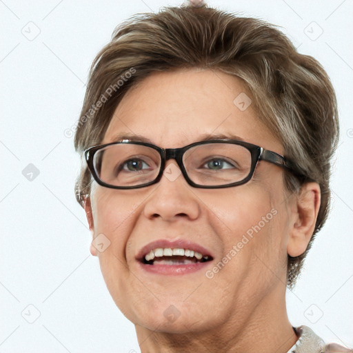 Joyful white adult female with short  brown hair and blue eyes