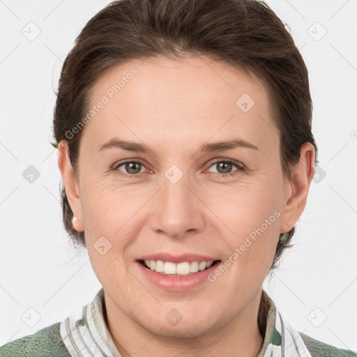 Joyful white adult female with medium  brown hair and grey eyes