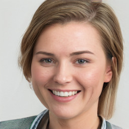 Joyful white young-adult female with medium  brown hair and blue eyes