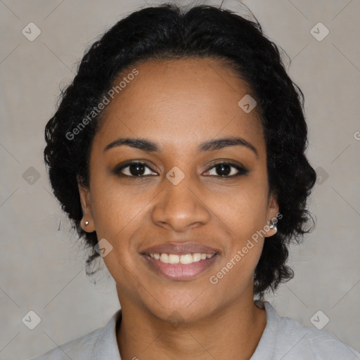 Joyful black young-adult female with long  black hair and brown eyes