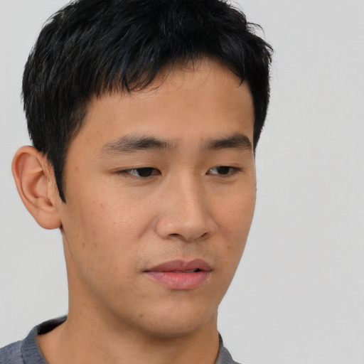 Neutral asian young-adult male with short  brown hair and brown eyes