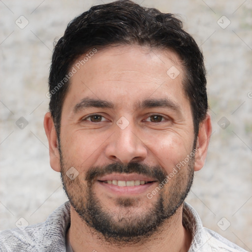 Joyful white adult male with short  black hair and brown eyes