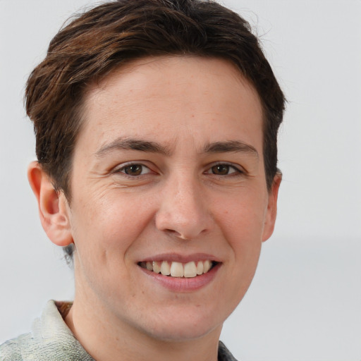 Joyful white young-adult female with short  brown hair and grey eyes