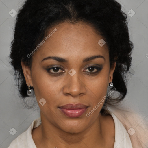 Joyful black adult female with medium  brown hair and brown eyes