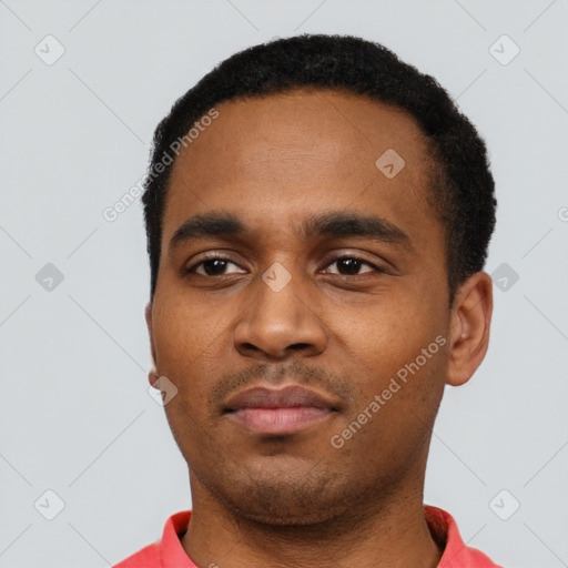 Neutral latino young-adult male with short  black hair and brown eyes