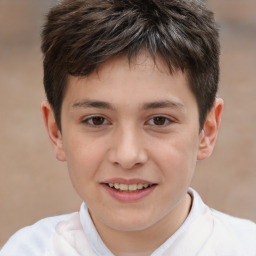 Joyful white child male with short  brown hair and brown eyes