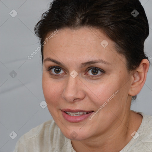 Joyful white adult female with short  brown hair and brown eyes