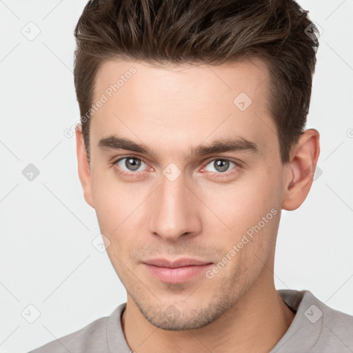 Neutral white young-adult male with short  brown hair and brown eyes