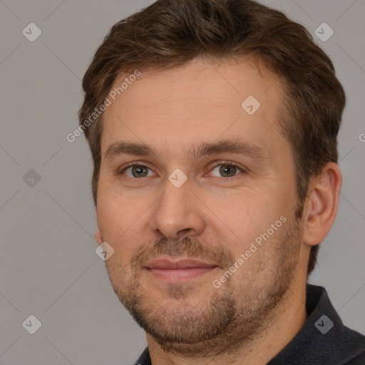 Joyful white adult male with short  brown hair and brown eyes