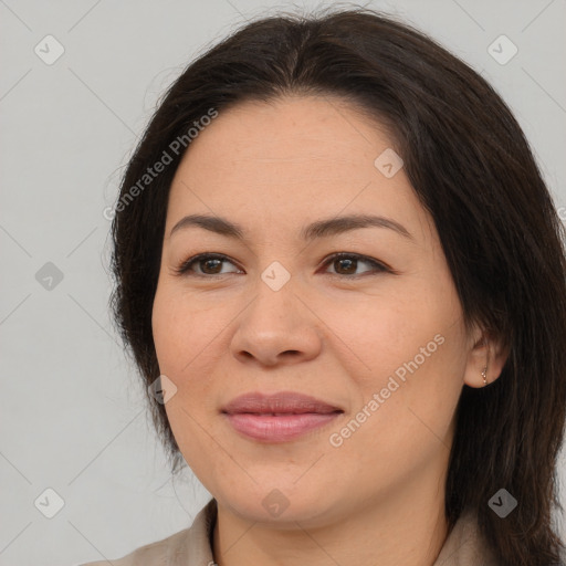 Joyful asian young-adult female with long  brown hair and brown eyes