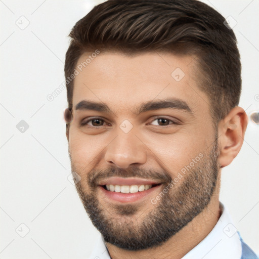 Joyful white young-adult male with short  brown hair and brown eyes