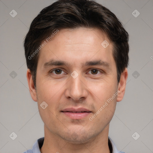 Joyful white adult male with short  brown hair and brown eyes