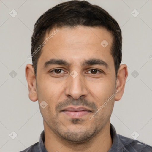Joyful white young-adult male with short  black hair and brown eyes