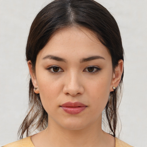 Joyful white young-adult female with medium  brown hair and brown eyes