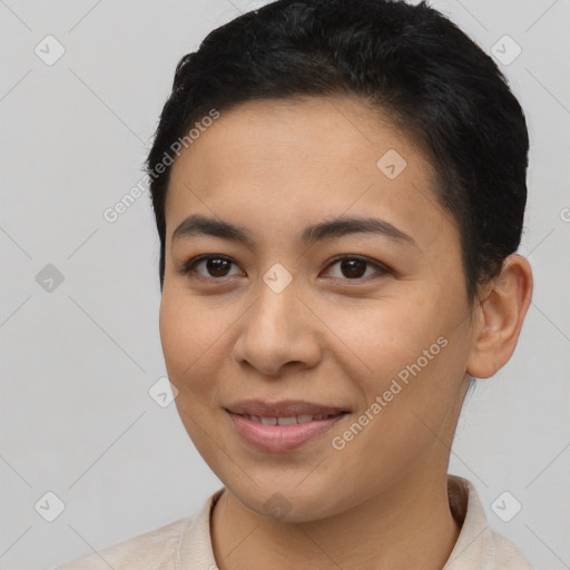 Joyful latino young-adult female with short  brown hair and brown eyes