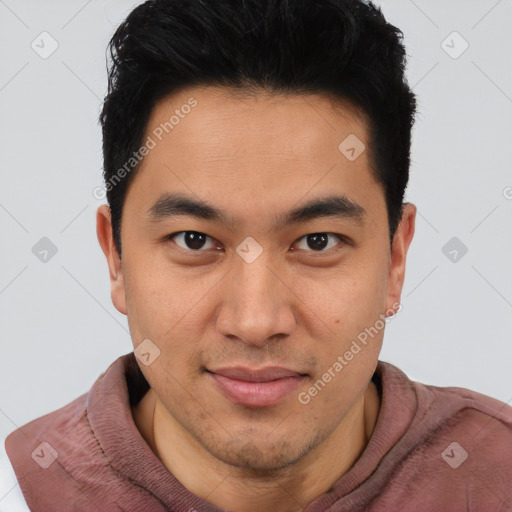 Joyful asian young-adult male with short  brown hair and brown eyes