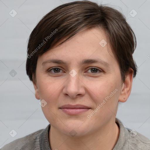 Joyful white young-adult female with short  brown hair and grey eyes