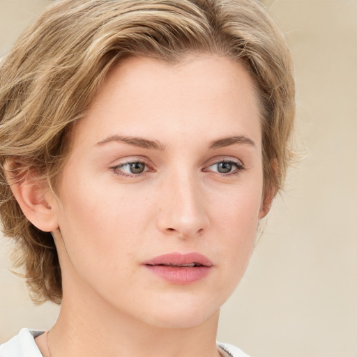 Joyful white young-adult female with medium  brown hair and green eyes