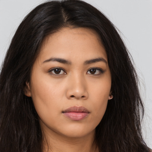 Neutral asian young-adult female with long  brown hair and brown eyes