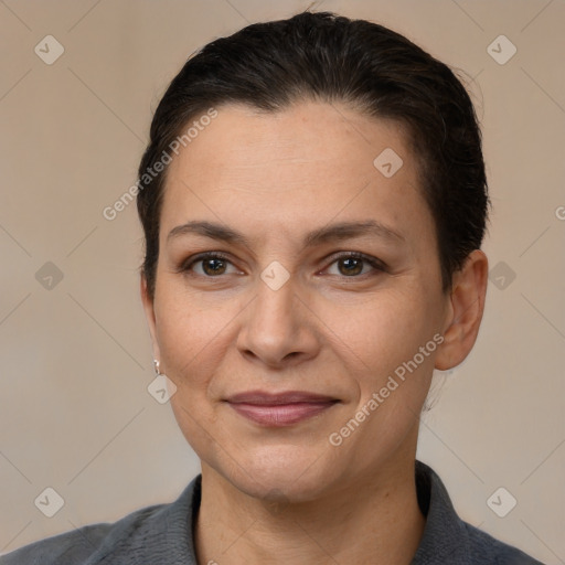 Joyful white adult female with short  brown hair and brown eyes