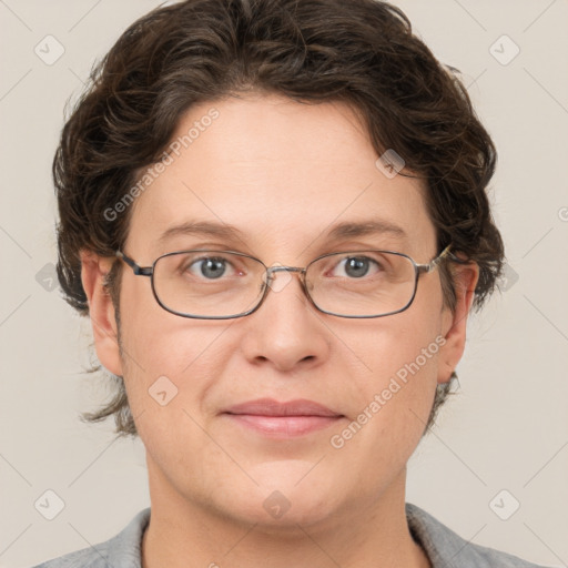 Joyful white adult female with short  brown hair and grey eyes