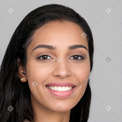 Joyful latino young-adult female with long  brown hair and brown eyes