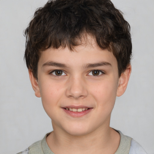 Joyful white child male with short  brown hair and brown eyes