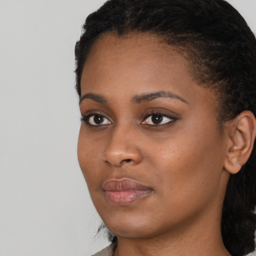 Neutral black young-adult female with short  black hair and brown eyes