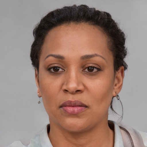 Neutral black adult female with short  brown hair and brown eyes