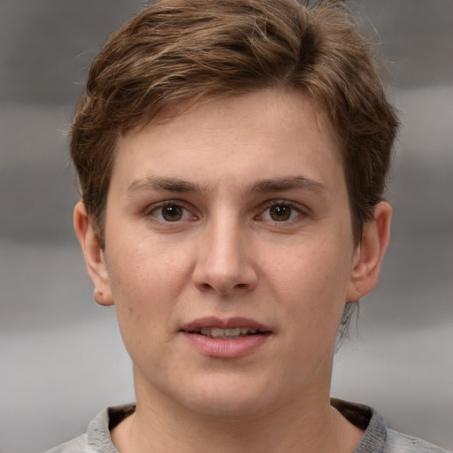 Joyful white young-adult female with short  brown hair and grey eyes