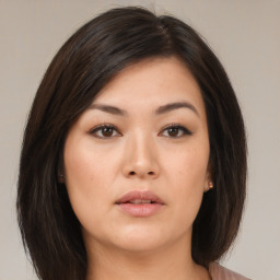 Neutral asian young-adult female with medium  brown hair and brown eyes