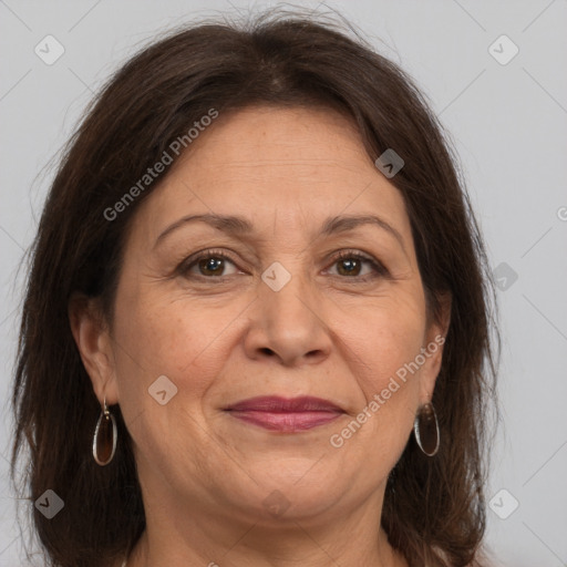 Joyful white adult female with medium  brown hair and grey eyes